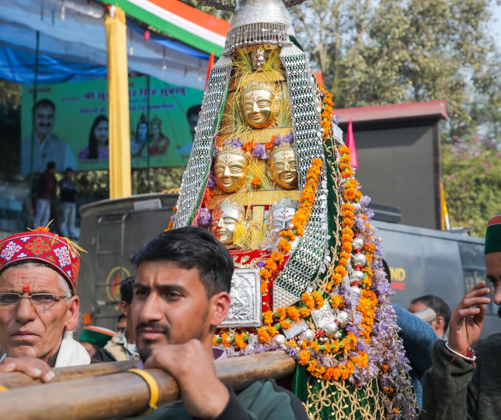 A palanquin of one of the visiting Deities, represented by one or more mohras (masks), usually the top one, and related Gods and Goddesses
