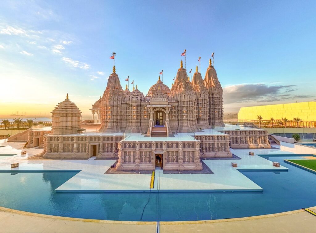 Doors reopened: (above) The water surrounding the BAPS Hindu Mandir temple is symbolic of India’s holy rivers; (below) HH Sheikh Abdullah bin Zayed Al Nahyan warmly received Swami Brahmaviharidas at his private palace in Abu Dhabi.