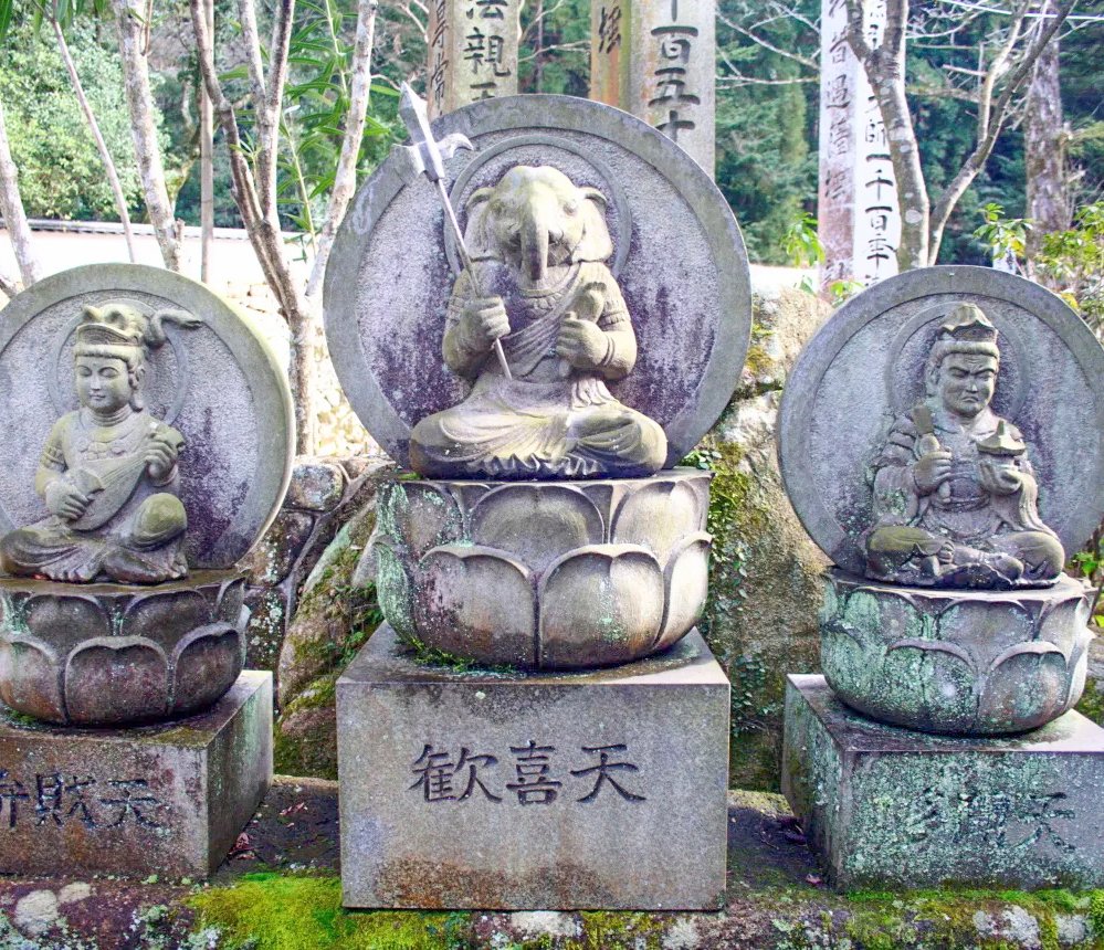 Hinduism everywhere: (from left) Stone Deities in Japan—Saraswati, Ganesha (holding a daikon radish rather than His broken tusk), Lakshmi